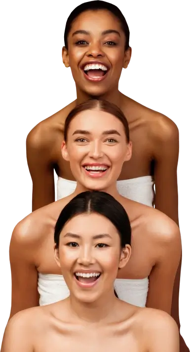 beauty and health institute three women wrapped in towels smiling and laughing together