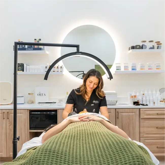 beauty and health institute woman in a salon enjoying a facial treatment